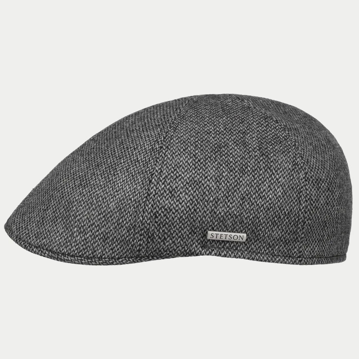 Casquette plate Texas gris anthracite de profil, laine à chevrons et emblème métal Stetson sur le côté
