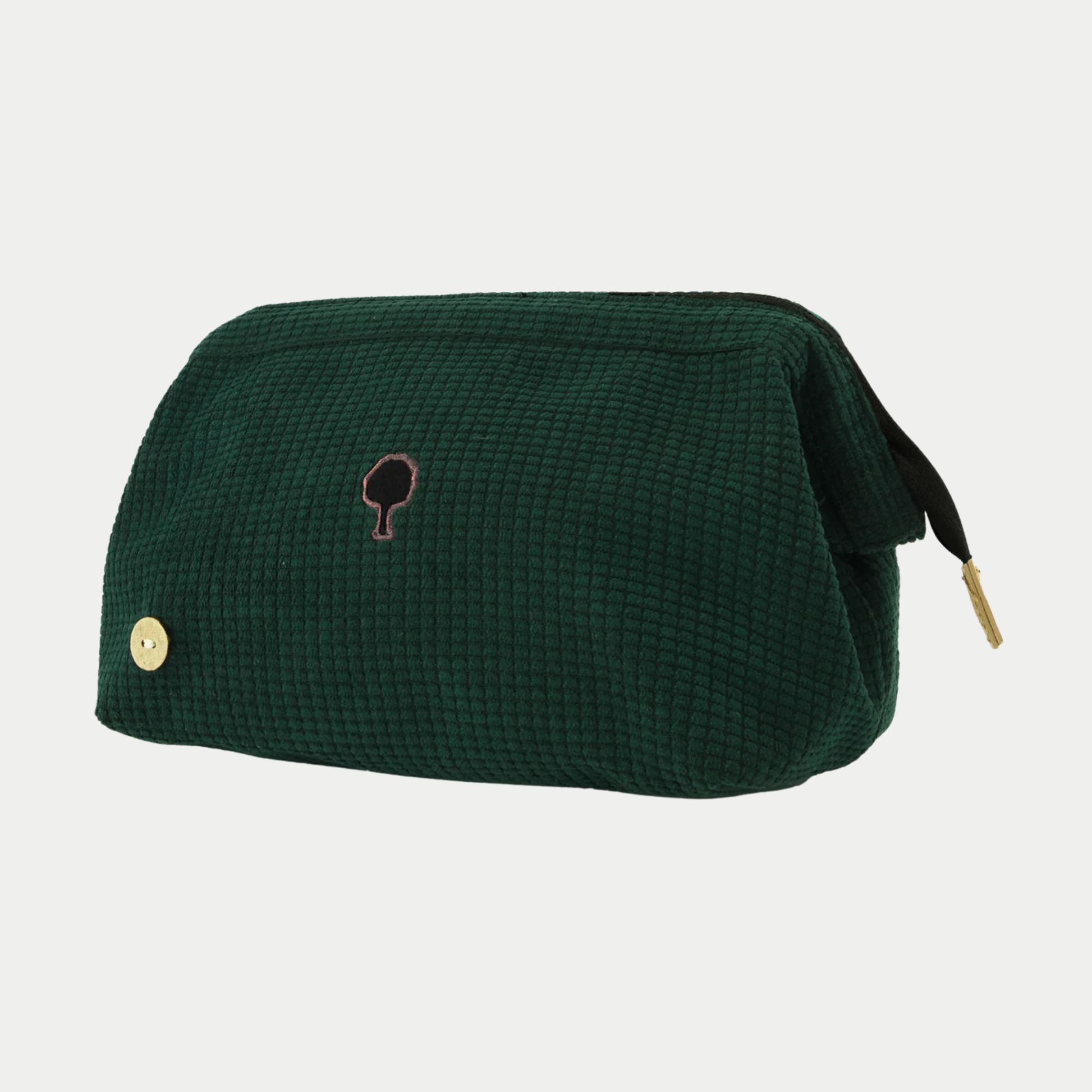 Trousse de toilette Faguo velours côtelé vert foncé de trois quarts, extrémité du ruban de zip noire et tirette dorée
