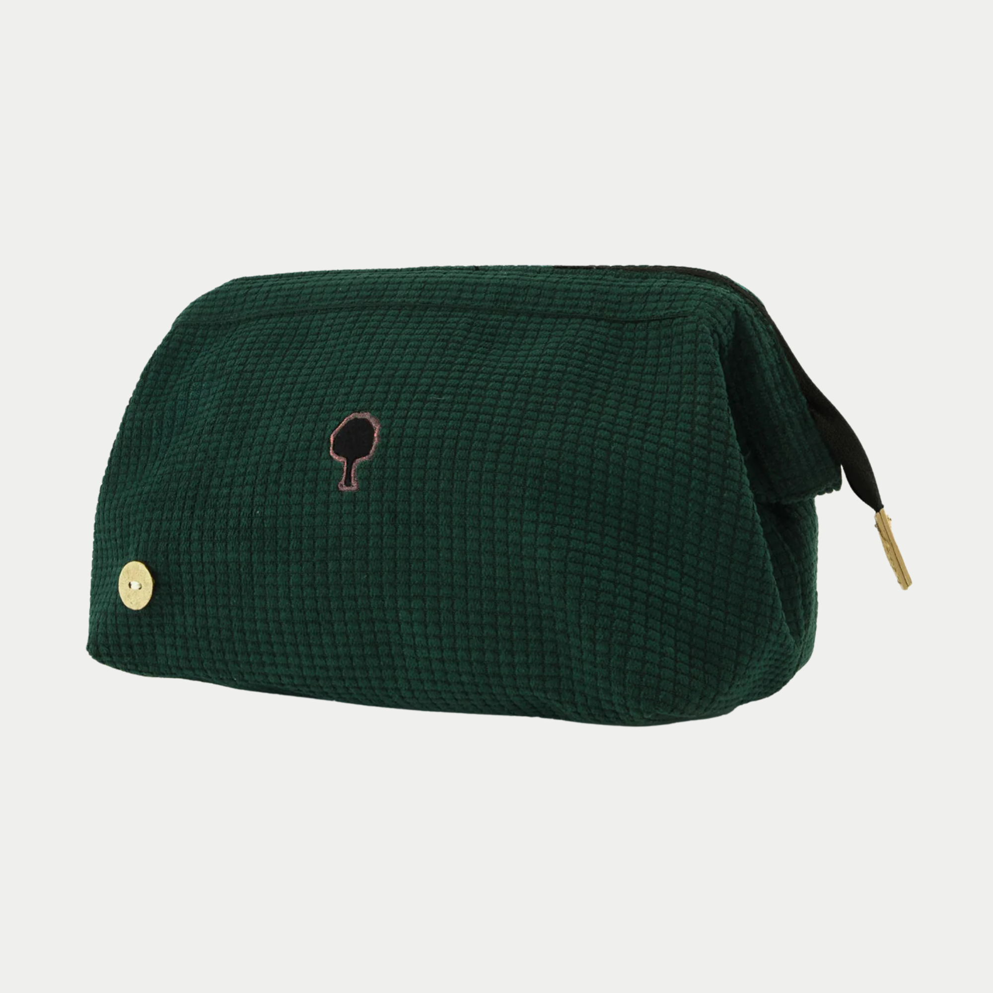 Trousse de toilette Faguo velours côtelé vert foncé de trois quarts, extrémité du ruban de zip noire et tirette dorée