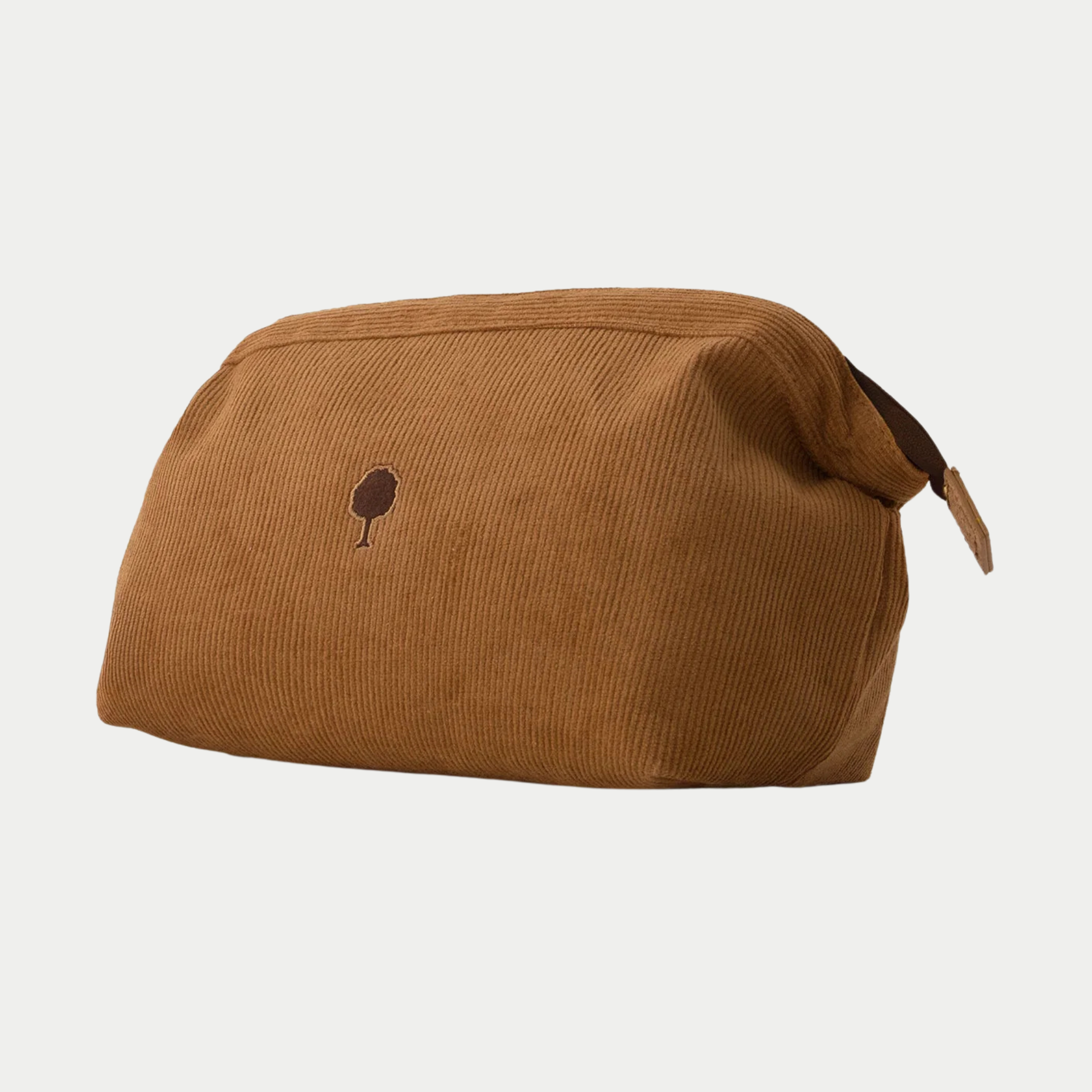 Trousse de toilette Faguo velours côtelé camel de trois quarts, patte de préhension marron sur le côté