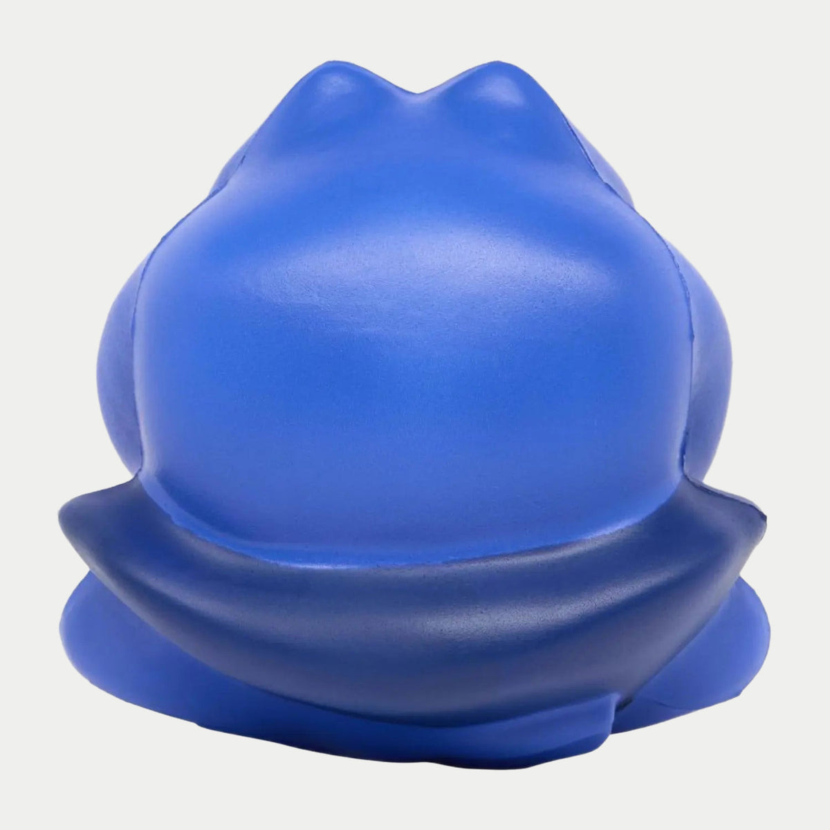 Dos arrondi de la balle anti-stress grenouille bleue, mousse lisse et pattes repliées