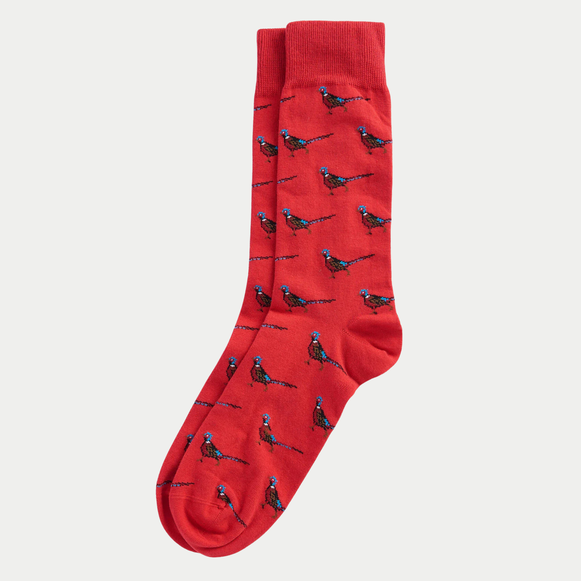 Chaussettes Barbour Mavin rouge vif posées à plat, faisans au plumage brun cuivré et à la tête turquoise