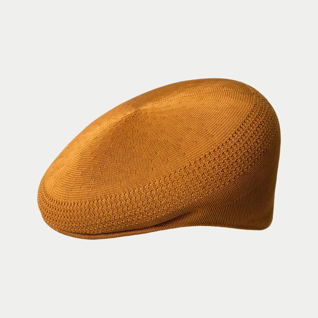 Casquette plate 504 Tropic Ventair ocre ambré, maille tressée aux bandes ajourées, de profil