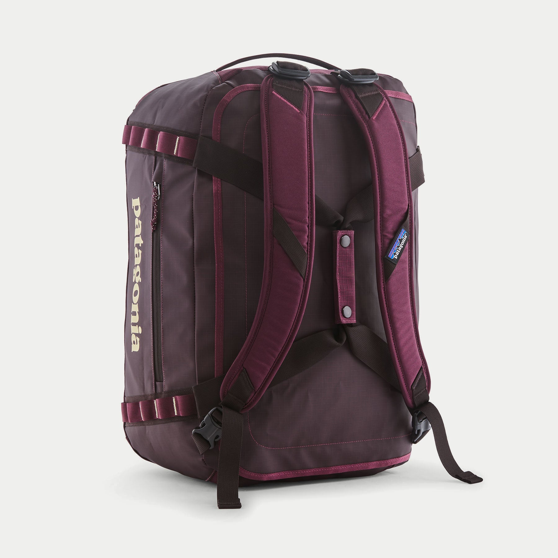 Dos du Duffel Black Hole 40L Berry Fig : bretelles amovibles rembourrées, boucles de réglage et poche zippée latérale