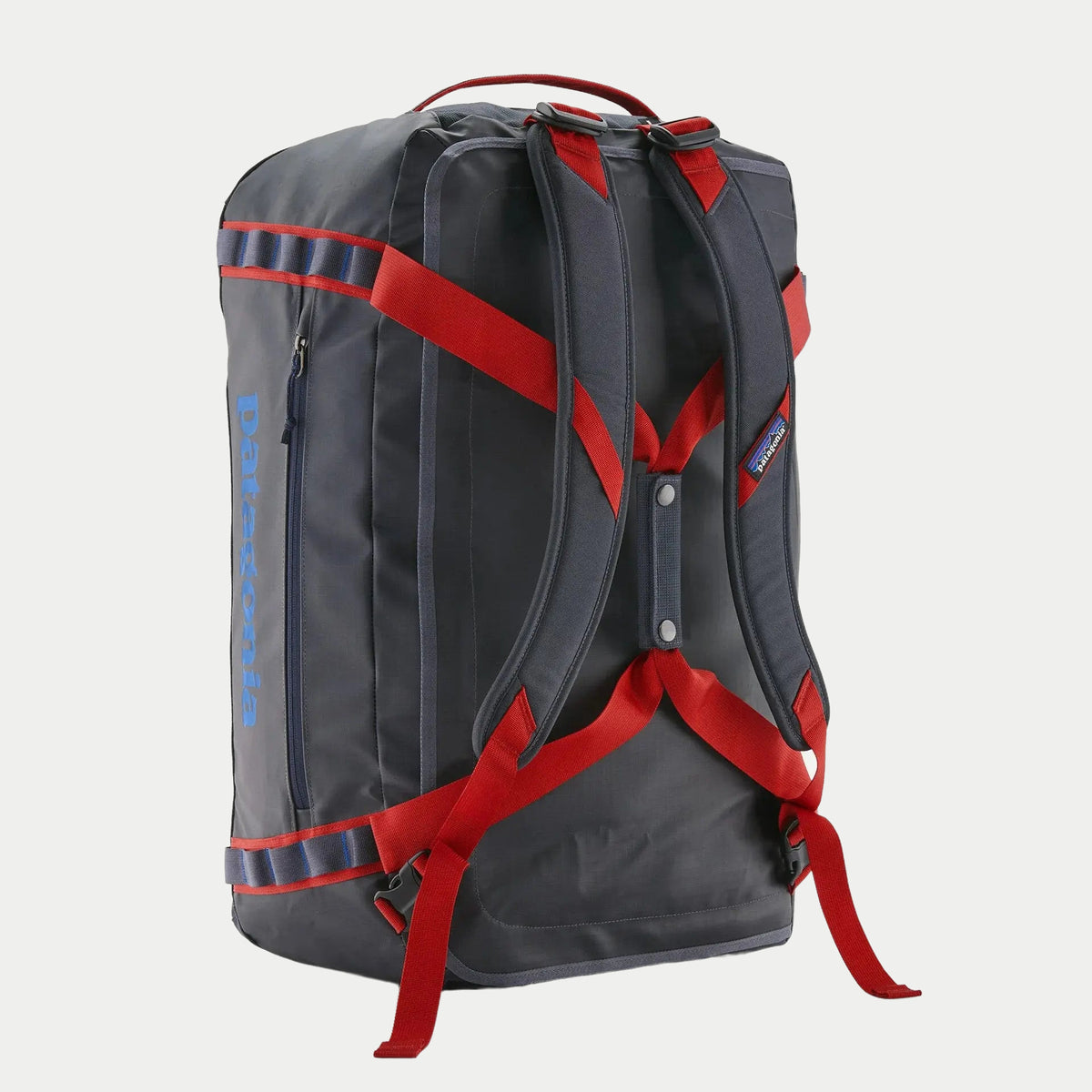 Dos du Black Hole Duffel 55L Smolder Blue, bretelles rembourrées et sangles de compression