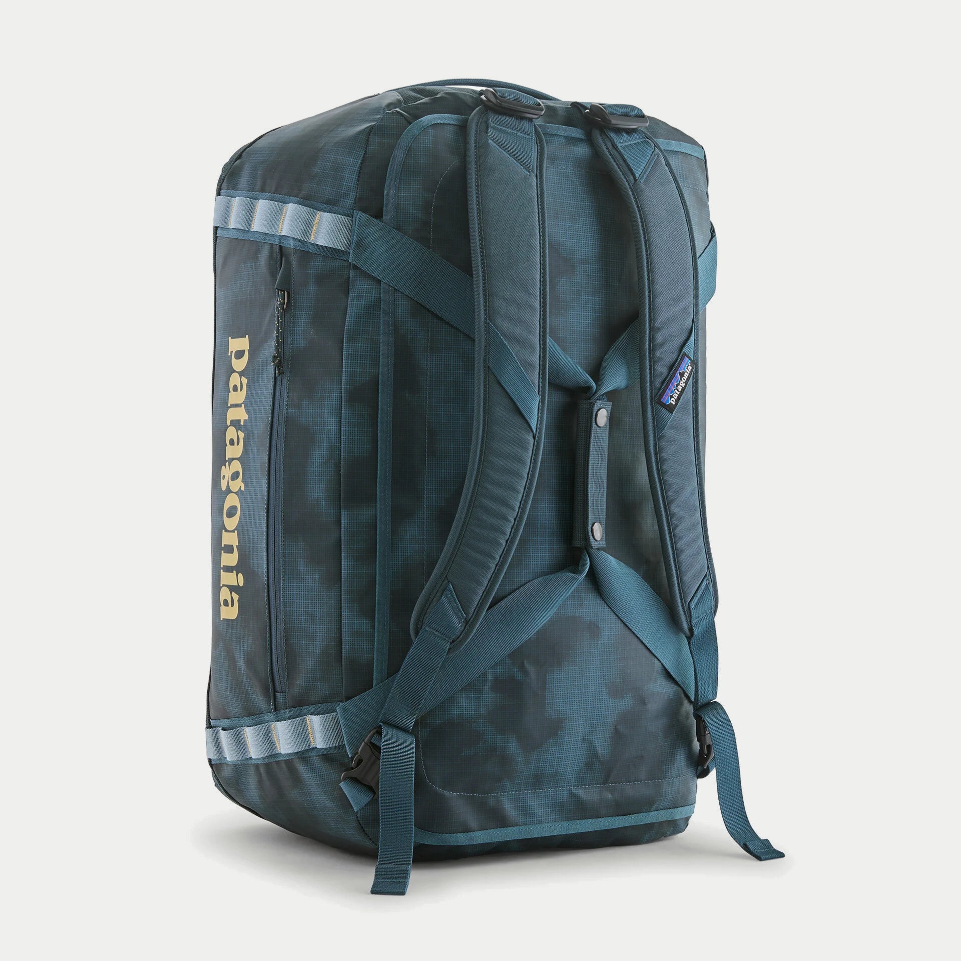 Dos du sac Black Hole Duffel 55L Summit Blue Patagonia debout : harnais de bretelles amovibles et sangles daisy chain