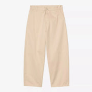 Brady Pant Wall Carhartt WIP vu de face : toile beige sable, poches italiennes, passants, coupe ample fuselée
