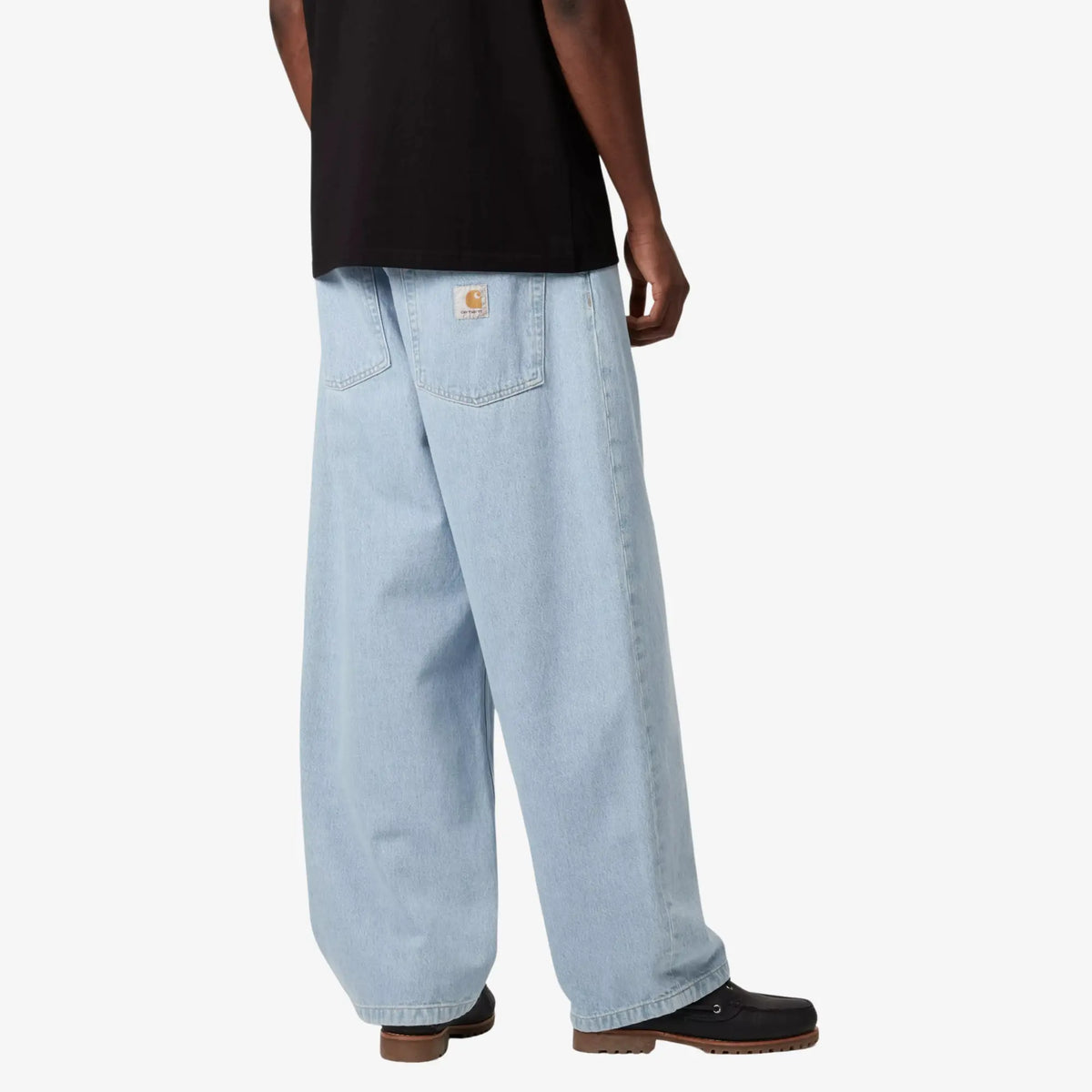 Brandon Pant Blue Heavy Worn Bleached porté de dos en trois-quarts : jambe très large, patine claire aux coutures