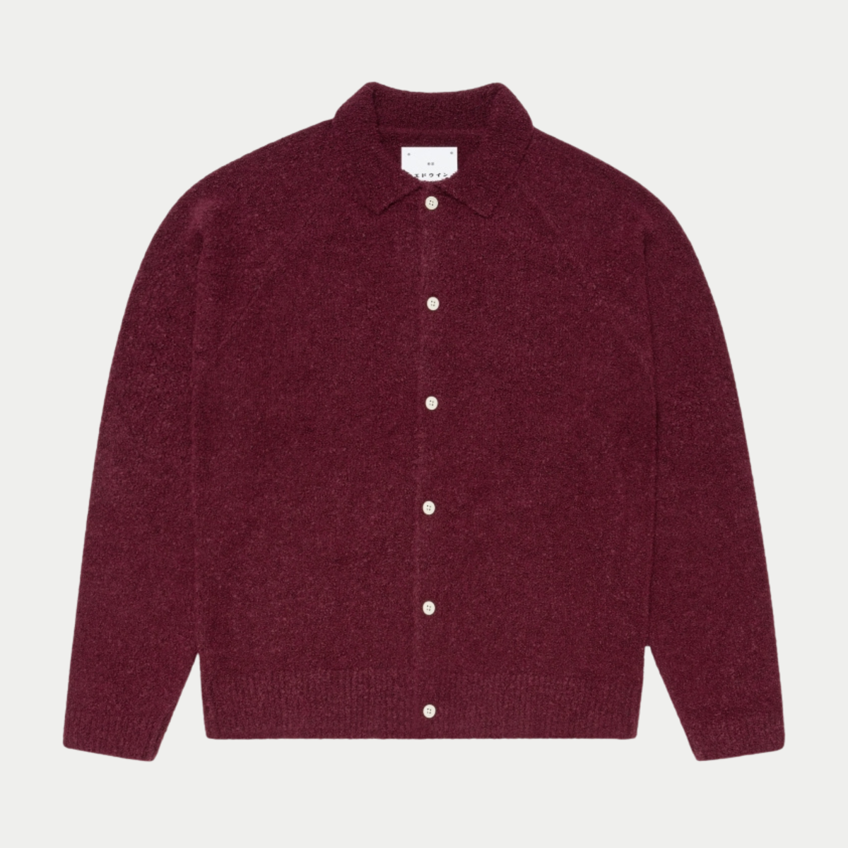 Cardigan Gemini Edwin bordeaux en maille bouclette, à plat de face, col chemise et boutons ivoire