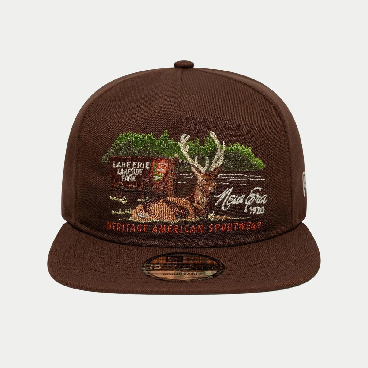 Face : scène brodée du cerf et mention Heritage American Sportwear