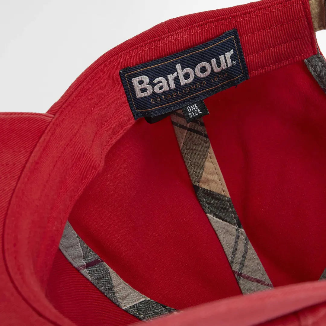 Étiquette intérieure Barbour taille unique, cousue entre le rouge brique et le tartan