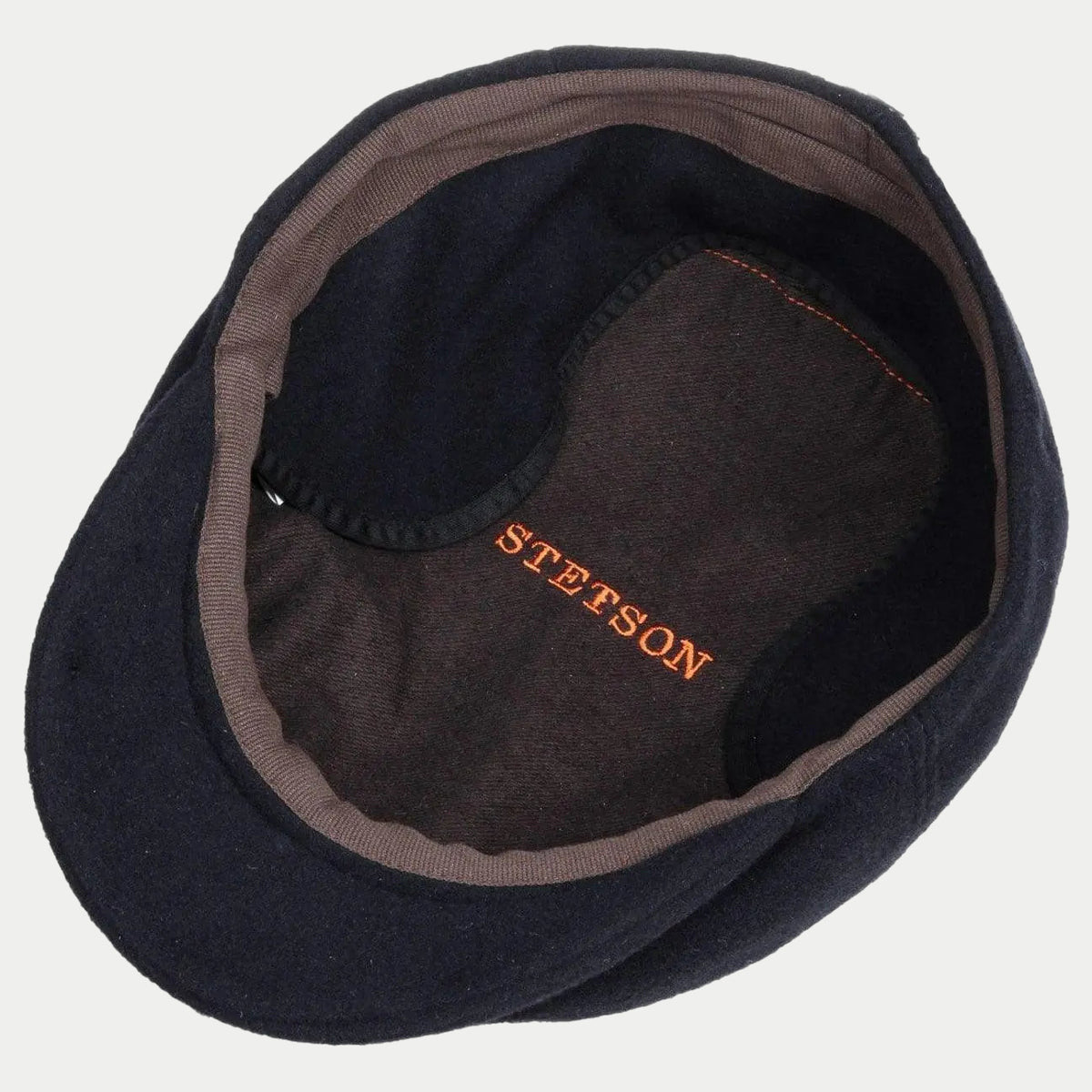 Intérieur bleu marine, doublure brune et signature Stetson brodée en orange