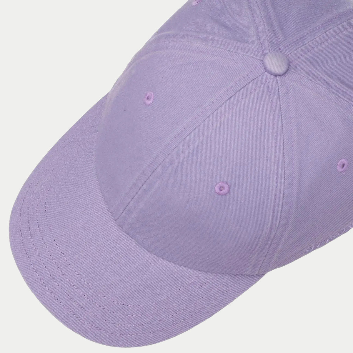 Dessus de la Rector lilas : bouton recouvert et œillets d'aération brodés