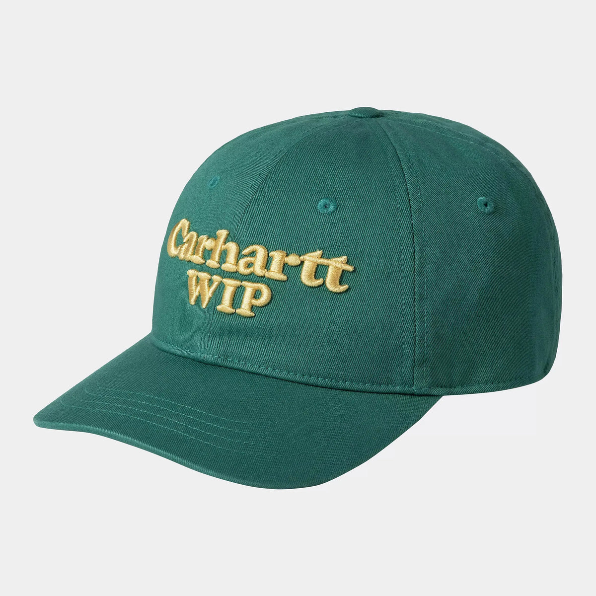 Casquette Script Carhartt WIP vert sapin à visière courbée, calotte souple et lettrage brodé jaune pâle