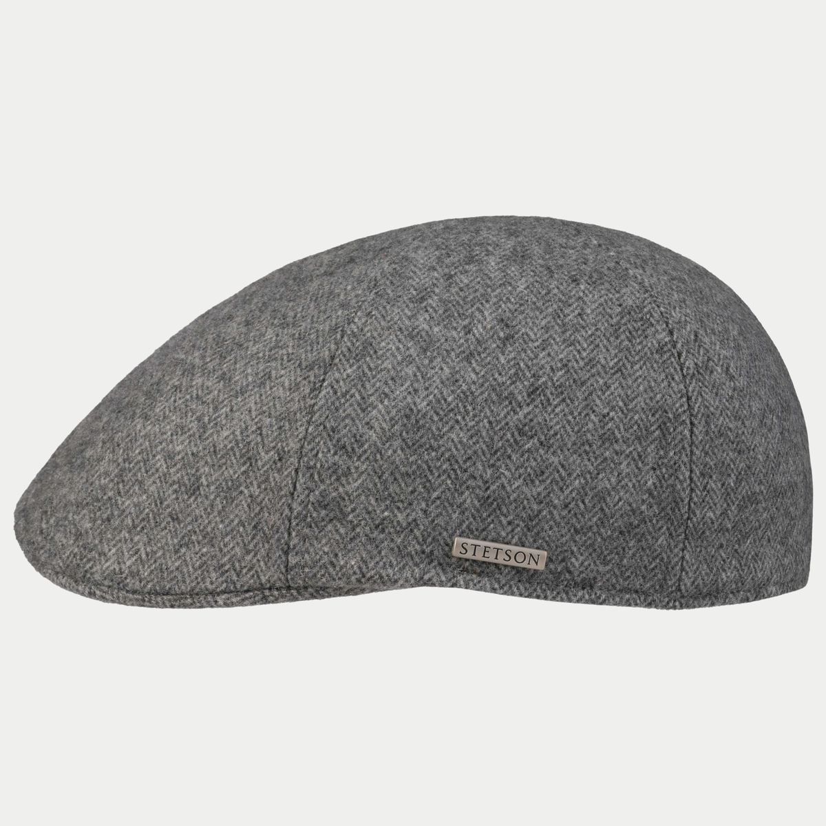 Casquette plate Texas Stetson en laine à chevrons gris chiné, vue de profil, plaque métallique sur le côté