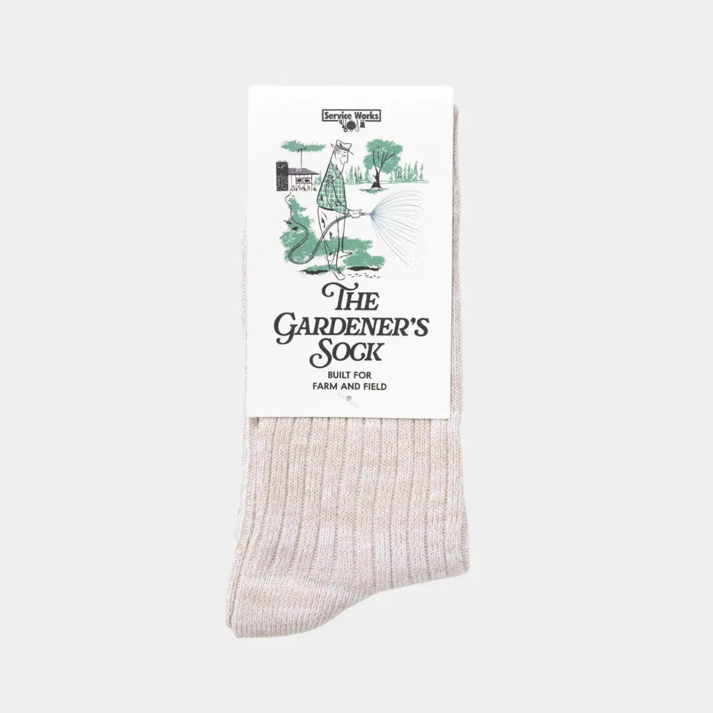 Chaussette du Jardinier beige chinée sous son carton illustré The Gardener's Sock, Built for Farm and Field