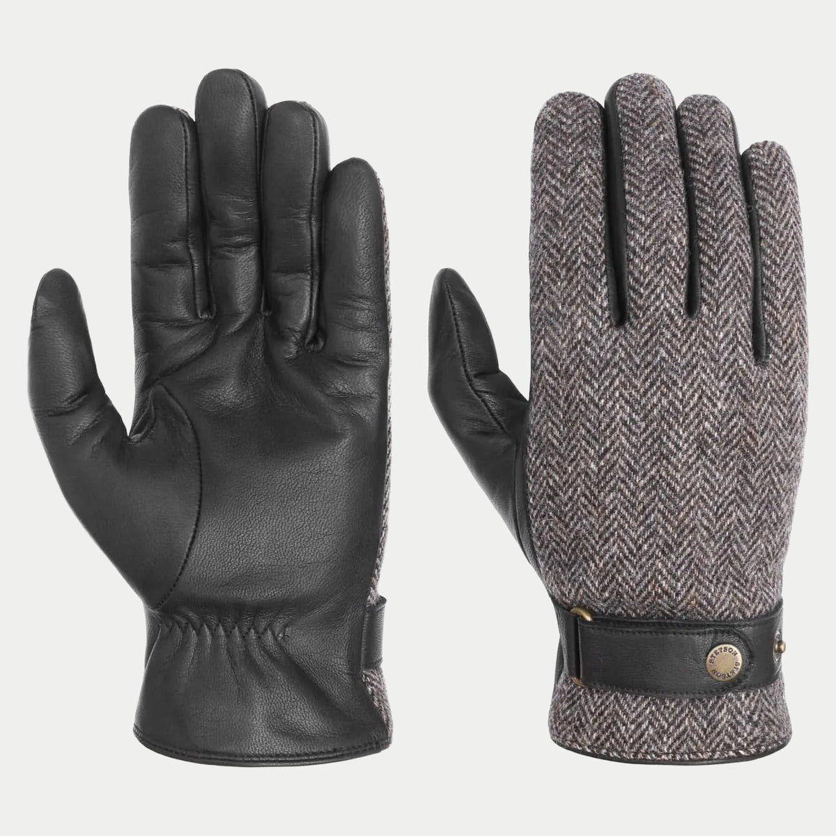 Paire de gants, paume en cuir noir et dessus en laine à chevrons gris-brun