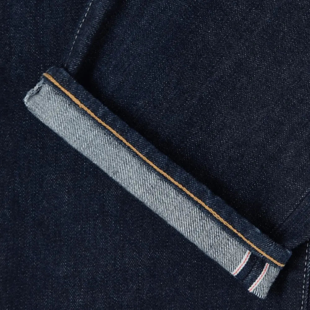Ourlet retroussé du jean Loose Blue Rinsed, lisière selvedge à liseré rouge et blanc