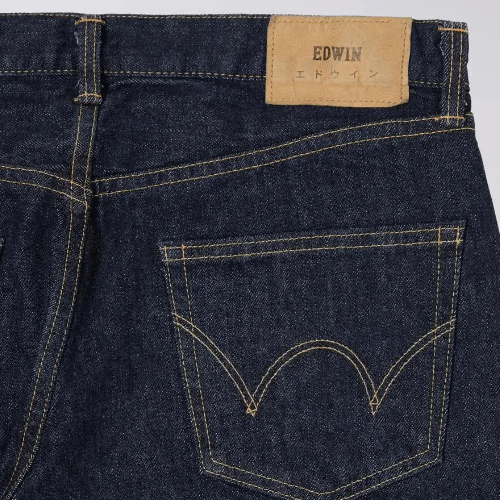 Poche arrière et patch cuir EDWIN du jean Selvedge Regular Tapered Blue Rinsed, double arc ocre