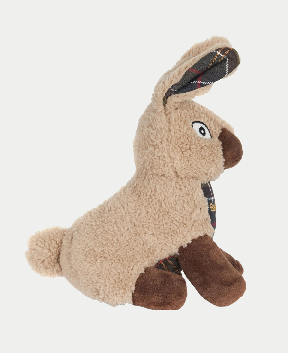 Profil du jouet lapin en sherpa beige, oreille dressée doublée de tartan et pattes brunes