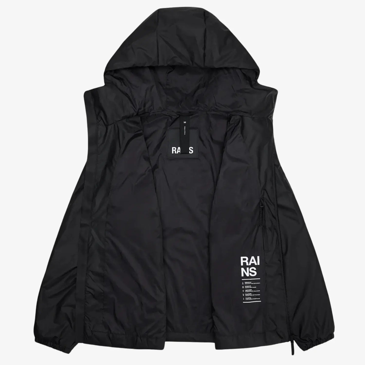 Lohja Insulated Jacket ouverte sur sa doublure noire, poche zippée intérieure et patch de marque