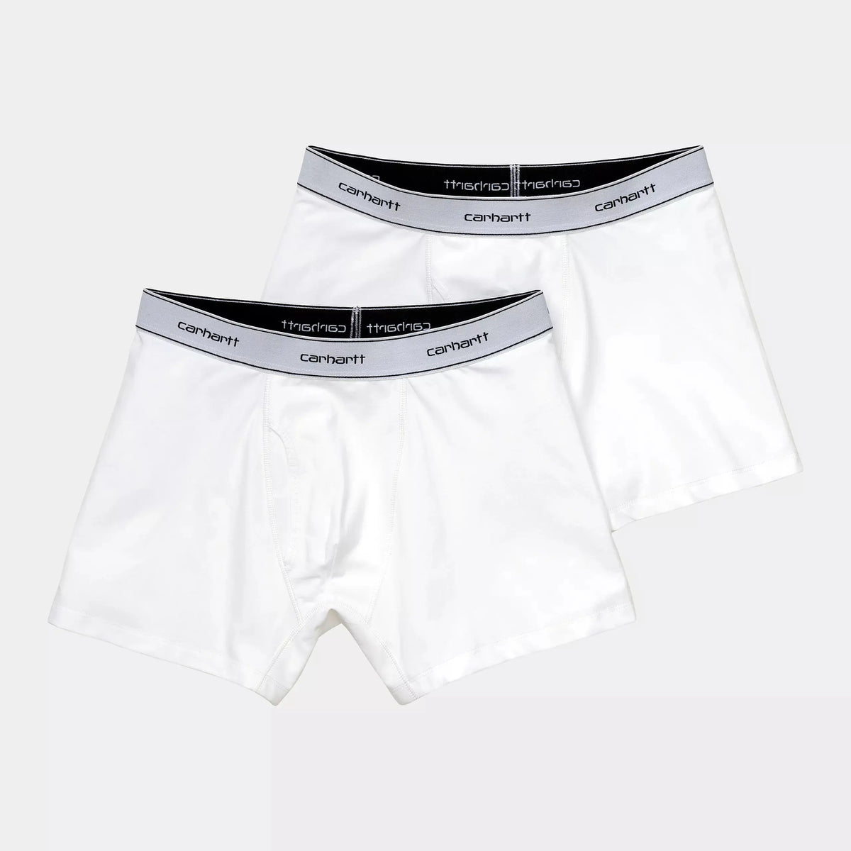Les deux boxers blancs du lot posés à plat l'un sur l'autre, ceinture élastique large au lettrage noir