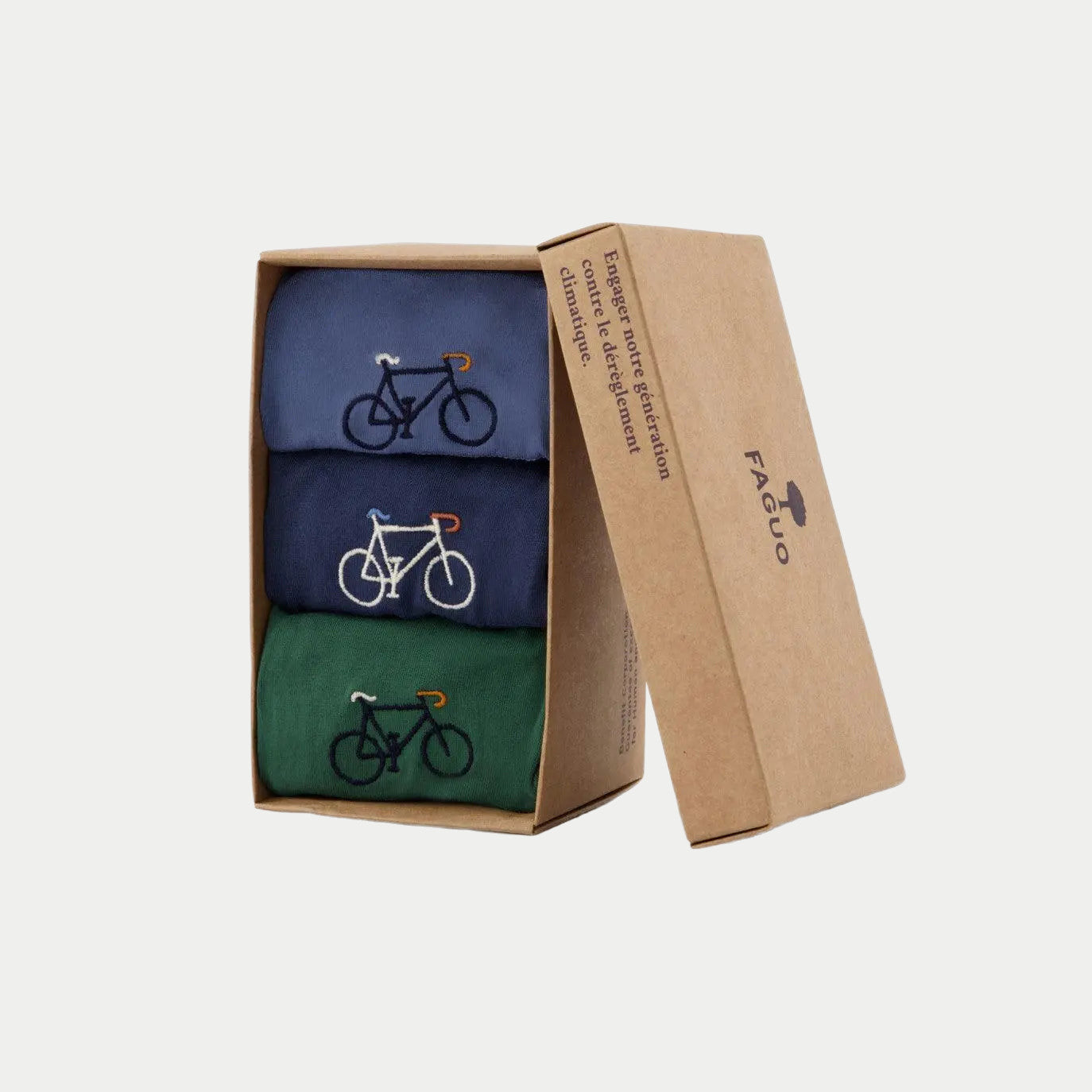 Coffret carton recyclé Faguo ouvert avec les 3 boxers vélo roulés : bleu jean, bleu marine et vert sapin