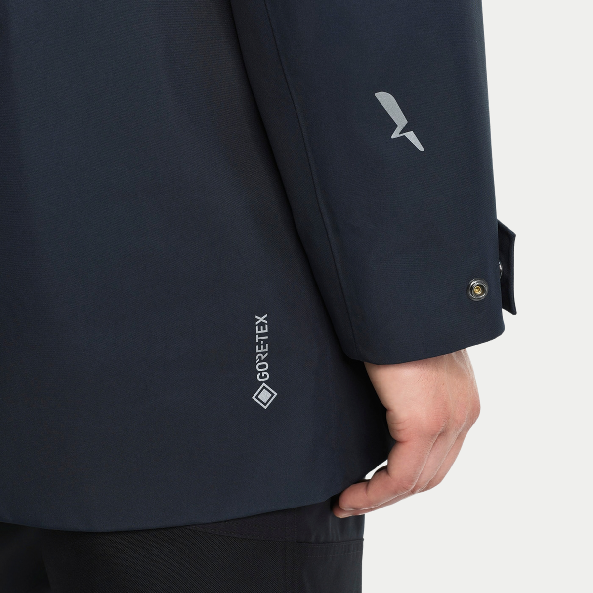 Manche de la parka T-KIT : logo GORE-TEX et oiseau BIRD réfléchissant