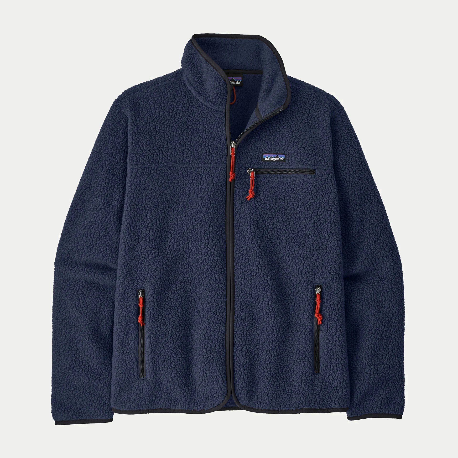 Veste polaire Retro Pile New Navy Patagonia à plat de face, zip intégral, tirettes cordon rouges et liserés noirs