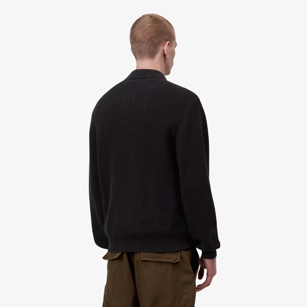 Dos porté du polo Miles noir, maille côtelée uniforme, bord-côte resserré à la taille et aux poignets