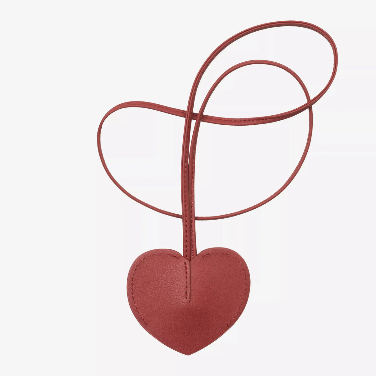 Cœur en cuir rouge brique du porte-clés Hartt Key Bell, face lisse sans marquage et lanière nouée en larges boucles
