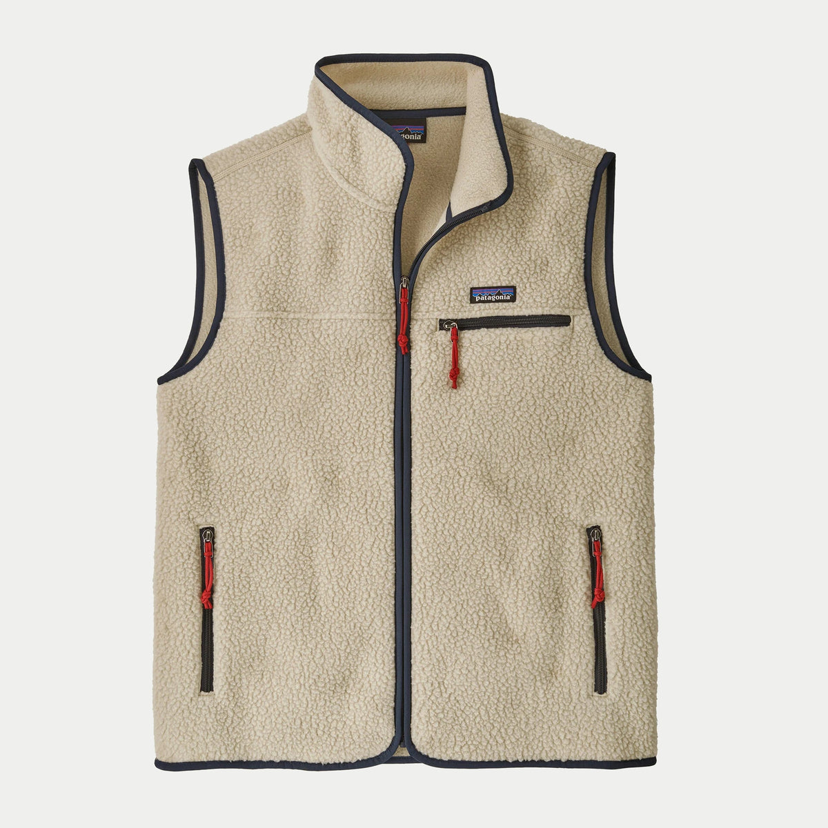 Gilet polaire Retro Pile Pelican Patagonia à plat de face, sherpa écru bordé de bleu marine, zip apparent et tirettes rouges