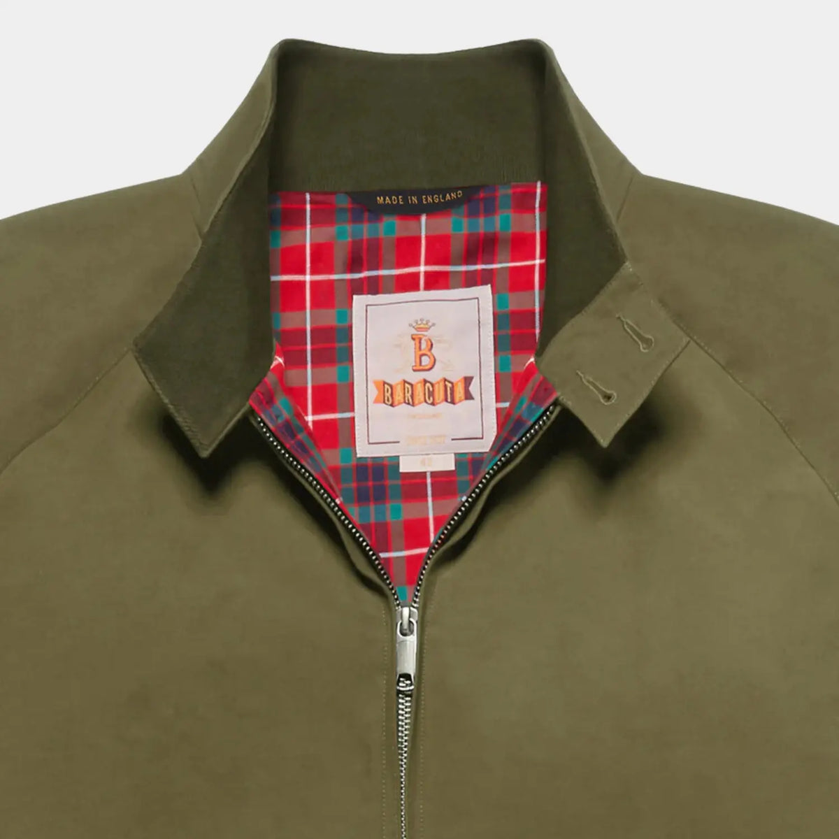 Col du G9 Army ouvert : patte boutonnée, sous-col côtelé et doublure tartan rouge, vert canard et bleu nuit