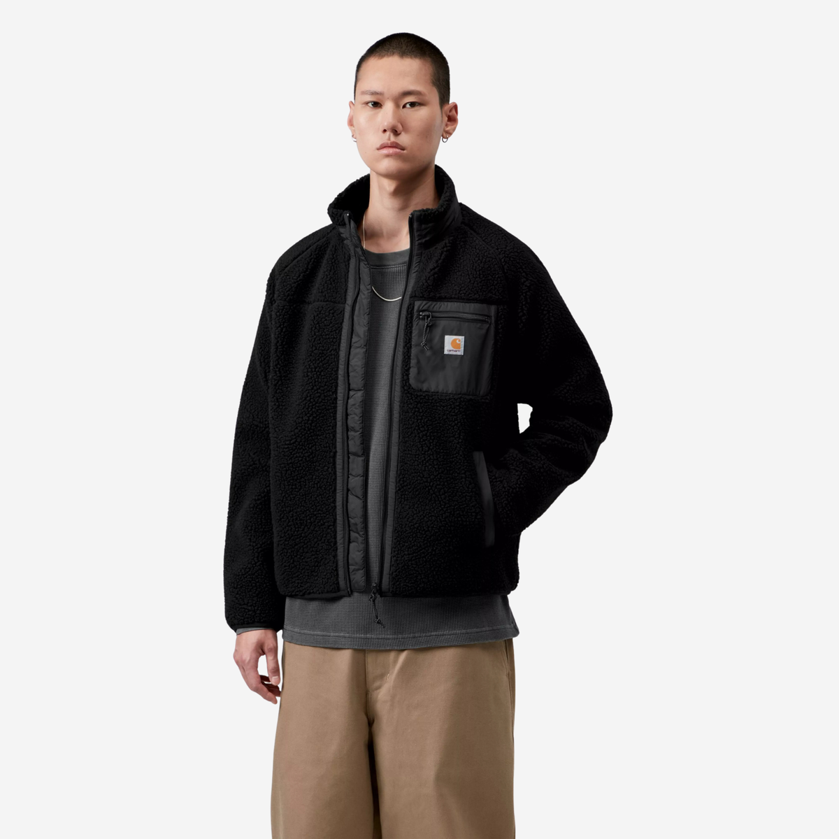 Veste Prentis noire portée ouverte, col montant en polaire et zip pleine hauteur bordé de taffetas