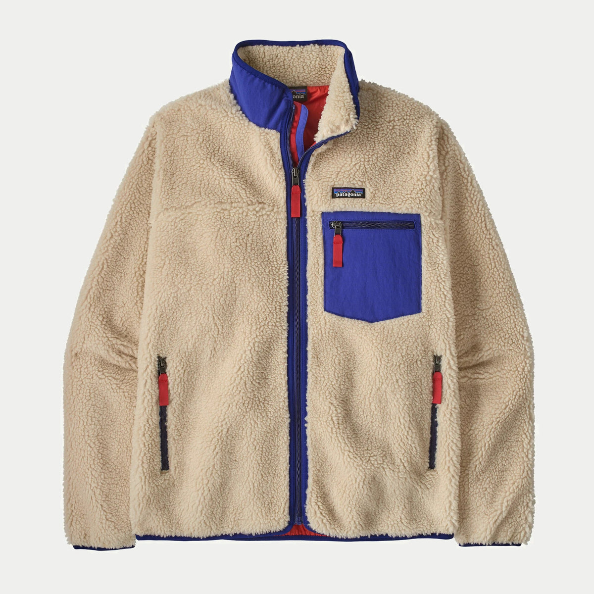 Veste polaire Retro-X Patagonia écru Dark Natural à plat, zip fermé, col et poche poitrine nylon cobalt, tirettes rouges
