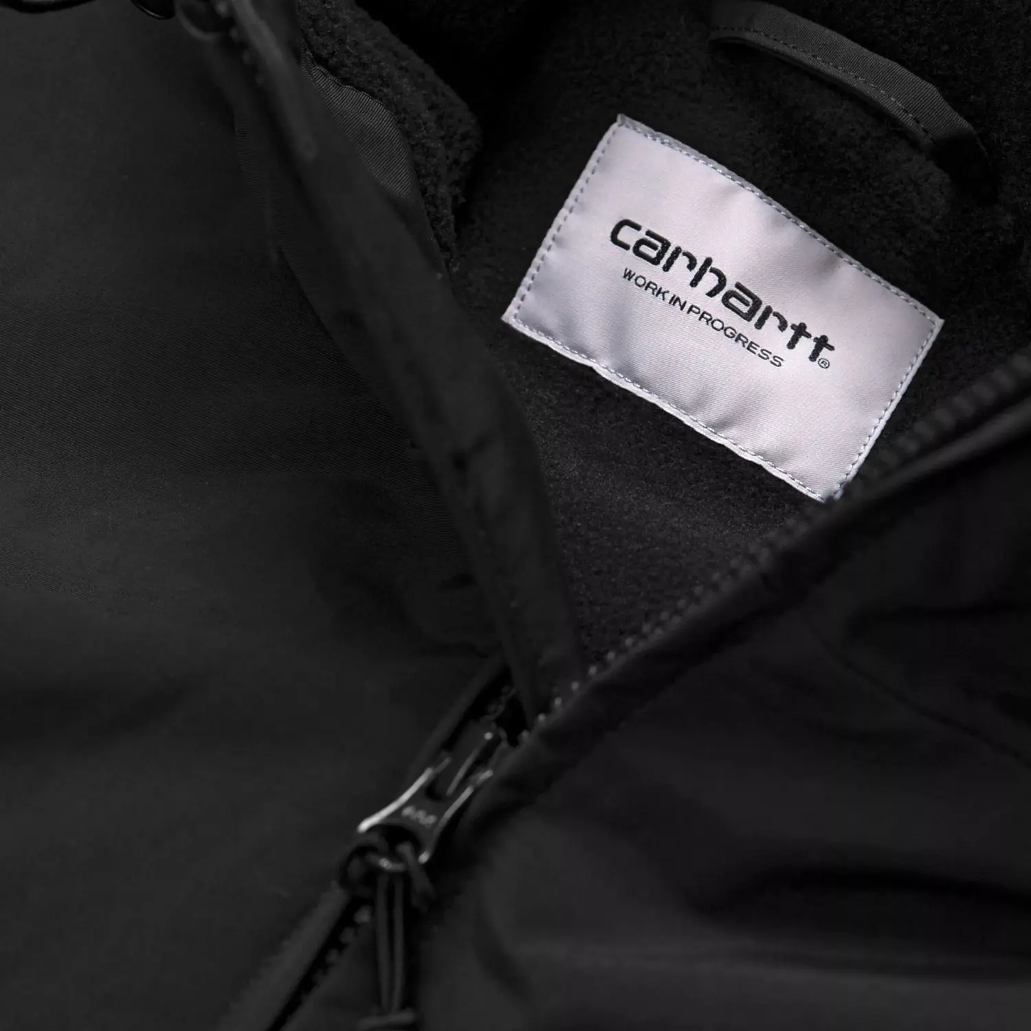 Doublure polaire noire et étiquette Carhartt Work In Progress à l’intérieur de la veste Sail