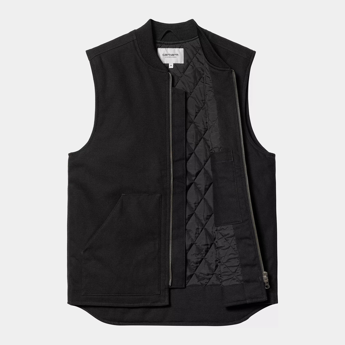 Veste sans manches noire ouverte à plat, doublure matelassée en losanges et poche intérieure apparente