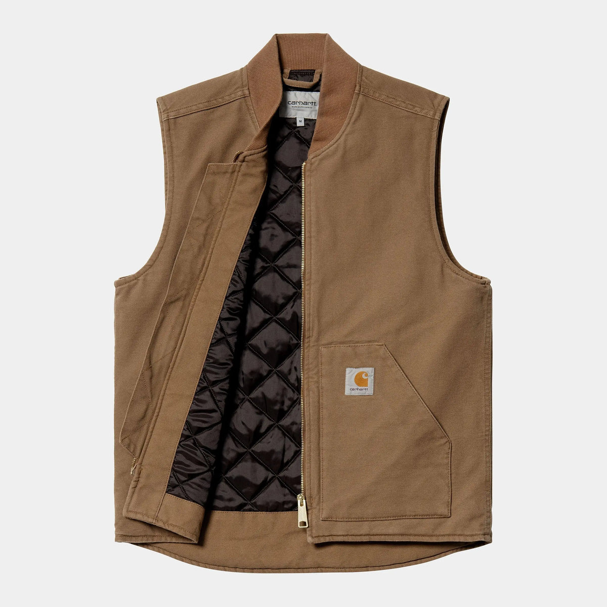 Veste sans manches brun caramel ouverte à plat, doublure matelassée noire en losanges et zip laiton