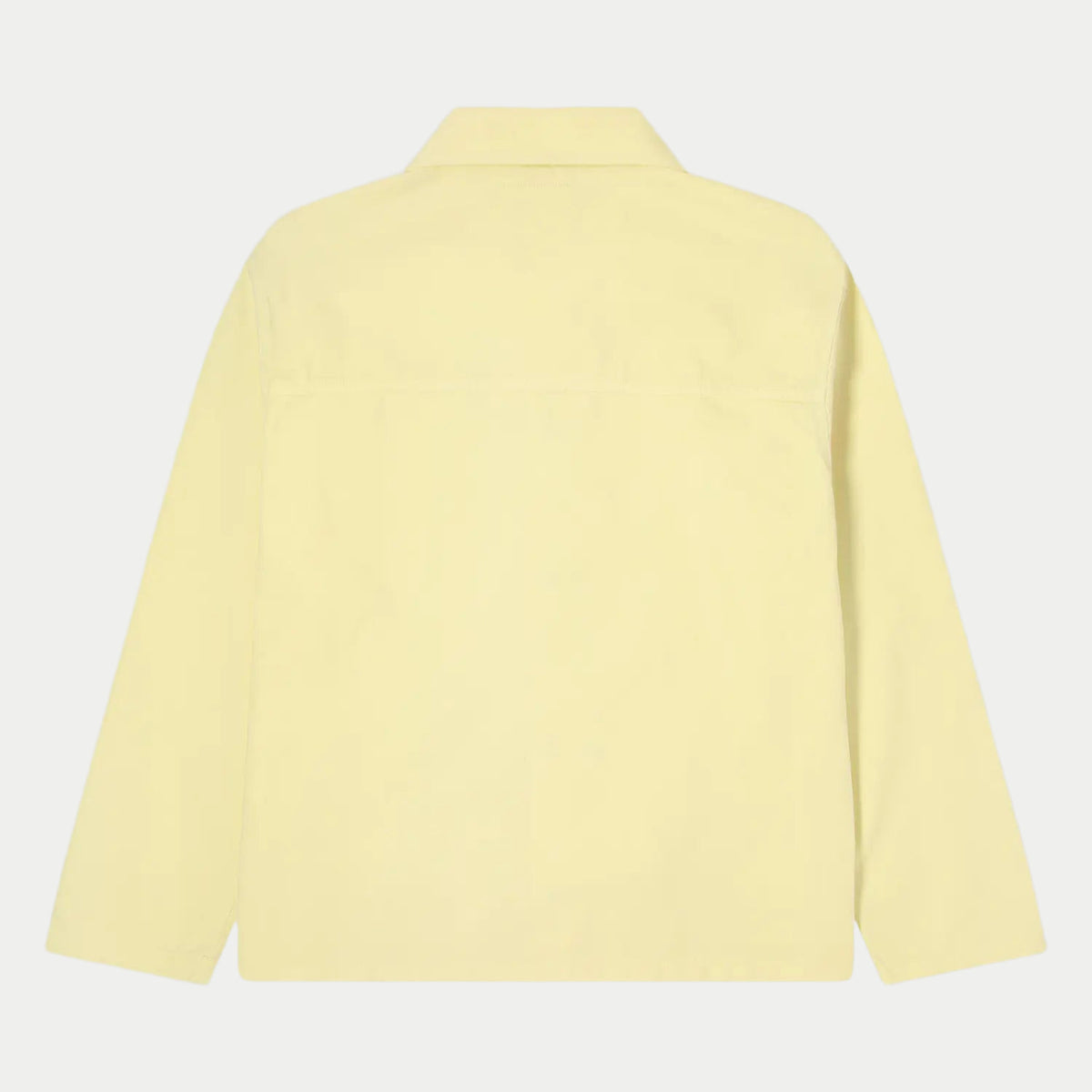 Dos à plat de la veste Trembley Whisper White jaune pâle, empiècement d'épaules et coupe droite